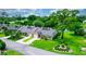 Aerial view of a lovely villa nestled in a community with a lake at 34 Fairway Dr # 1, Debary, FL 32713
