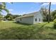 Rear view of house showing french doors and landscaping at 1790 17Th St, Orange City, FL 32763