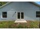 House exterior showcasing backyard and french doors at 1790 17Th St, Orange City, FL 32763