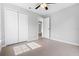 Bedroom with tile floors, double door closet and access to another room at 1790 17Th St, Orange City, FL 32763