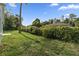 Large backyard with lush grass and a privacy fence at 1790 17Th St, Orange City, FL 32763