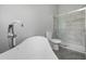 Contemporary bathroom with a free standing tub, glass shower, and marble tile at 1790 17Th St, Orange City, FL 32763
