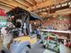 Spacious garage with golf cart, workbench, and ample storage at 824 Silver Oak Ave, The Villages, FL 32159
