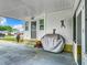 Covered patio with grill and golf decor at 824 Silver Oak Ave, The Villages, FL 32159