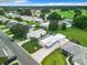 Aerial view of the home and surrounding neighborhood, showing its location and proximity to a golf course at 824 Silver Oak Ave, The Villages, FL 32159