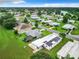 Aerial view showing a home's location in a community with a lake nearby at 824 Silver Oak Ave, The Villages, FL 32159