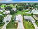 Aerial view of property showcasing its location in a community near a lake at 824 Silver Oak Ave, The Villages, FL 32159
