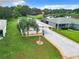 Aerial view showing a home's location in a community with lush landscaping at 824 Silver Oak Ave, The Villages, FL 32159