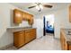 Kitchen with wood cabinets, granite countertops and appliances at 3660 Grand Ave, Deland, FL 32720