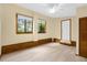 Bedroom with two windows, wood flooring and built-in storage at 3660 Grand Ave, Deland, FL 32720