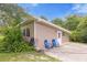Guest house with concrete patio and landscaping at 3660 Grand Ave, Deland, FL 32720