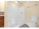 Bathroom with a shower tub, toilet and wood vanity at 3660 Grand Ave, Deland, FL 32720