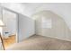 Spacious bedroom with sloped ceilings, built-in shelving and a large closet at 3660 Grand Ave, Deland, FL 32720