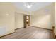 Bright bedroom with ceiling fan and wood-look flooring at 3660 Grand Ave, Deland, FL 32720