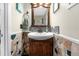 Small bathroom with updated vanity and stone tile at 3660 Grand Ave, Deland, FL 32720