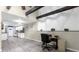 Open living space with exposed beams, a home office, and wood-look flooring at 3660 Grand Ave, Deland, FL 32720