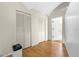 Large bedroom with light wood flooring and closets at 3660 Grand Ave, Deland, FL 32720