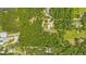 Aerial view of property highlighting its wooded acreage at 3660 Grand Ave, Deland, FL 32720