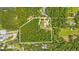 Aerial view of property highlighting its wooded acreage at 3660 Grand Ave, Deland, FL 32720
