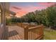 Wooden deck overlooking backyard and wooded area at 3660 Grand Ave, Deland, FL 32720