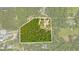 Aerial view of property highlighting its wooded acreage at 3660 Grand Ave, Deland, FL 32720