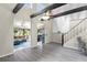 Spacious living area with high ceilings, exposed beams, and views into the sunroom at 3660 Grand Ave, Deland, FL 32720