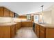Kitchen with island and wood cabinets at 3660 Grand Ave, Deland, FL 32720