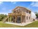 Two-story home with a deck, stairs, and attached garage at 3660 Grand Ave, Deland, FL 32720