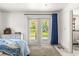 Bedroom with French doors leading to the backyard at 3660 Grand Ave, Deland, FL 32720