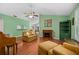 Comfortable living room with hardwood floors, fireplace, and built-in shelving at 3457 Martingale Ct, Port Orange, FL 32129