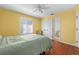 Bedroom with wood floors and bathroom access at 3457 Martingale Ct, Port Orange, FL 32129