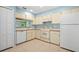 Efficient kitchen with white cabinets, dishwasher and refrigerator at 3457 Martingale Ct, Port Orange, FL 32129
