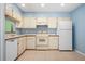 Clean kitchen featuring white cabinets and appliances at 3457 Martingale Ct, Port Orange, FL 32129