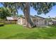 Spacious backyard with large oak tree and patio at 3457 Martingale Ct, Port Orange, FL 32129