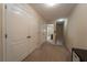 Upstairs hallway with multiple closets and doors to bedrooms at 5541 Rutherford Pl, Oviedo, FL 32765