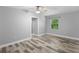 Simple bedroom with hardwood floors and neutral wall colors at 288 Silverstone Dr, Orange City, FL 32763