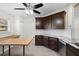 Renovated kitchen with granite countertops, dark cabinets, and an island at 288 Silverstone Dr, Orange City, FL 32763