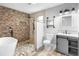 Spa-like bathroom with a freestanding tub and stone tile shower at 288 Silverstone Dr, Orange City, FL 32763