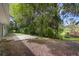 Private backyard with a small patio and lush vegetation at 288 Silverstone Dr, Orange City, FL 32763