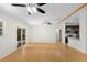 Spacious living room with hardwood floors and access to the backyard at 288 Silverstone Dr, Orange City, FL 32763
