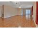 Spacious living room with hardwood floors, a chandelier, and lots of natural light at 47 Villa Villar Ct # 470, Deland, FL 32724
