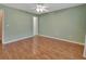 Spacious bedroom with laminate flooring and ceiling fan at 47 Villa Villar Ct # 470, Deland, FL 32724
