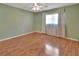 Well-lit bedroom with hardwood floors and neutral walls at 47 Villa Villar Ct # 470, Deland, FL 32724