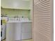 Convenient laundry room with washer, dryer and storage at 47 Villa Villar Ct # 470, Deland, FL 32724