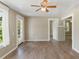 Living room with hardwood floors and access to other rooms at 2300 Calloway Dr, Orlando, FL 32810