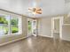 Living room with hardwood floors, a door to the backyard, and lots of natural light at 2300 Calloway Dr, Orlando, FL 32810