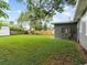 Spacious backyard with a large grassy area at 2300 Calloway Dr, Orlando, FL 32810