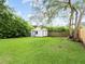 Large backyard with a shed and mature trees at 2300 Calloway Dr, Orlando, FL 32810