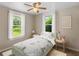 Charming bedroom with hardwood floors, a ceiling fan and plenty of natural light at 2300 Calloway Dr, Orlando, FL 32810