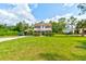 Two story house with green lawn at 4205 Quail Ranch Rd, New Smyrna Beach, FL 32168